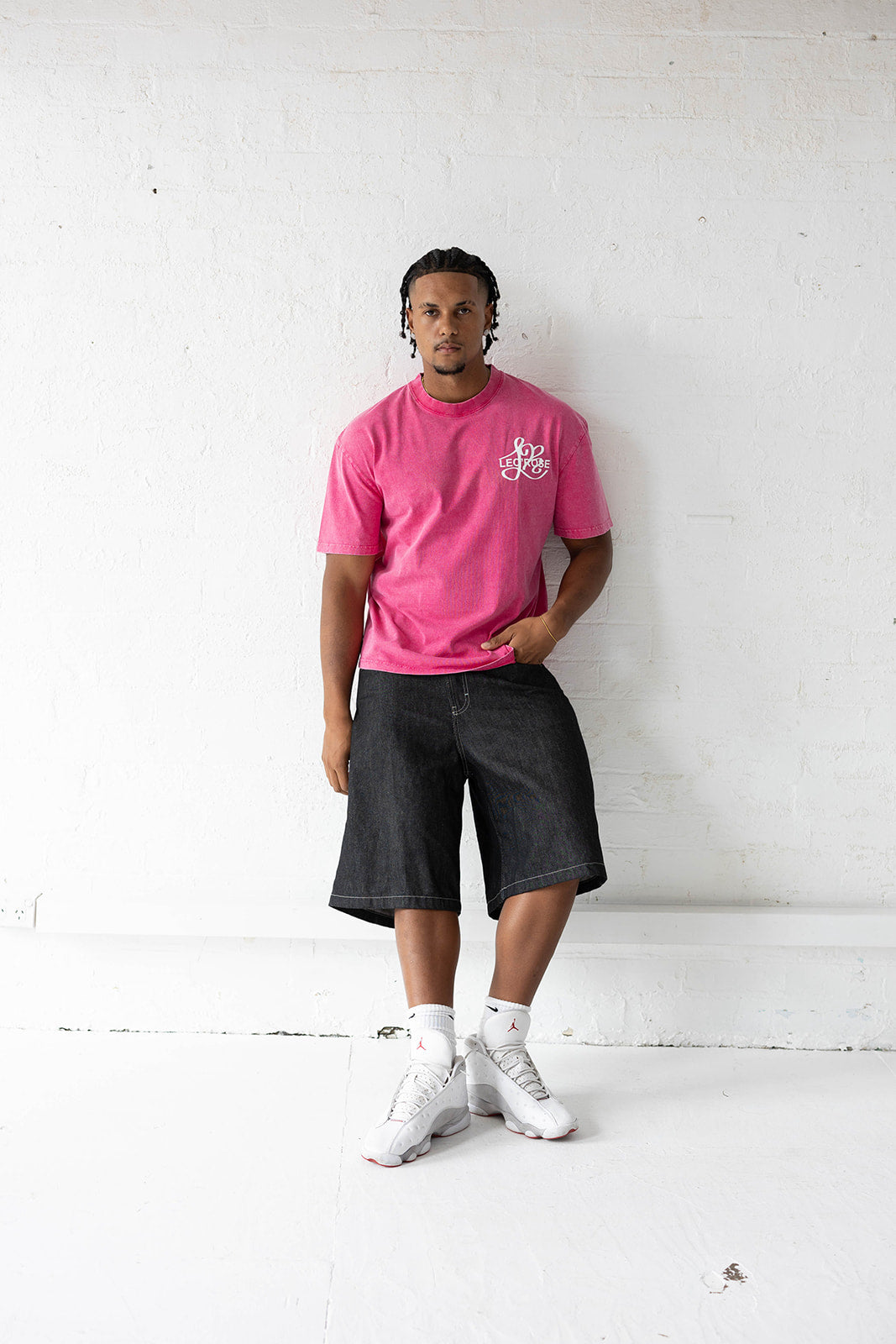 Man in a pink LEO'ROSE tee